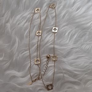 kate spade long gold necklace w/ spade cut outs